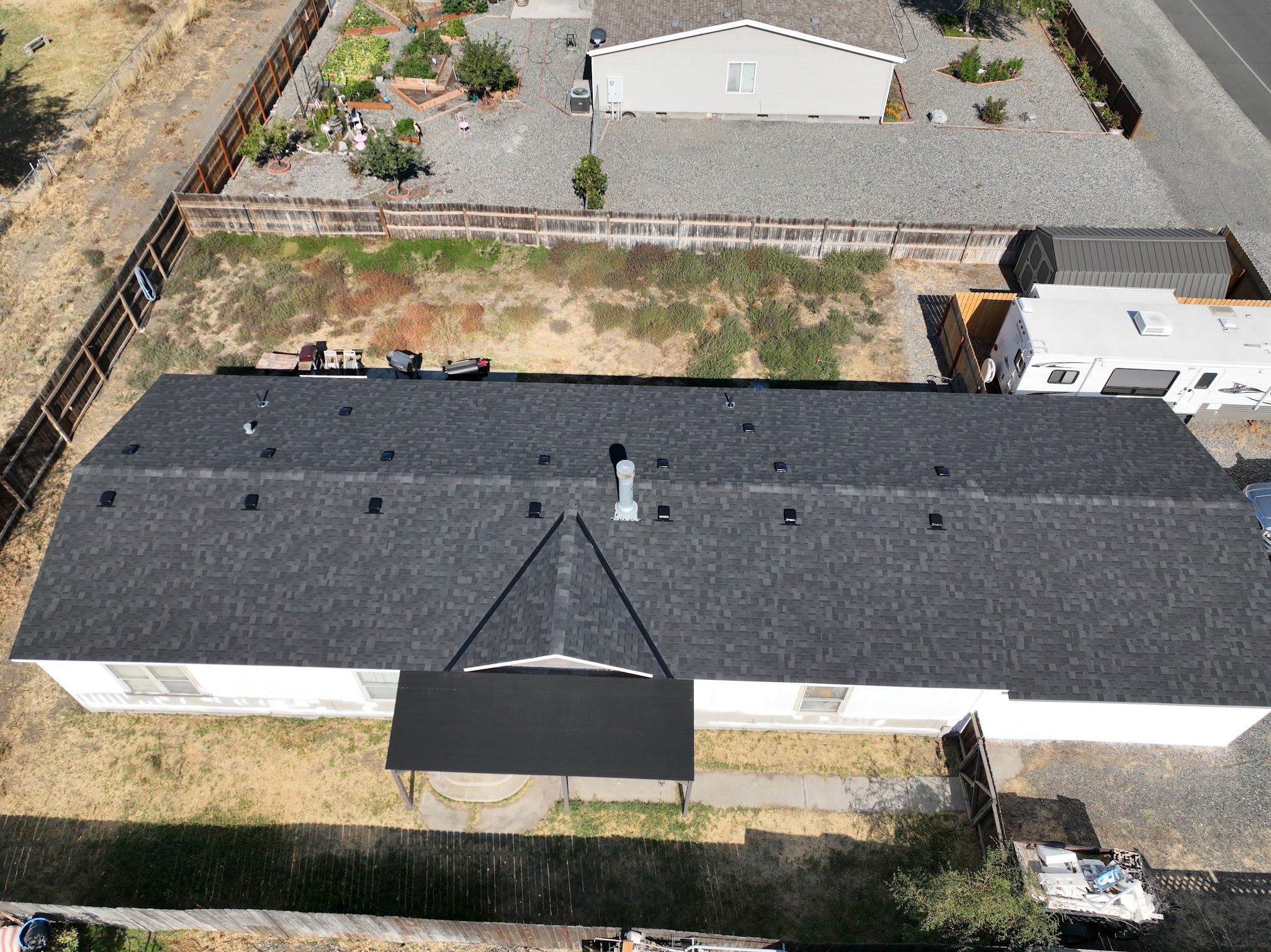 Aerial view of a completed roof replacement by Elias Construction Services